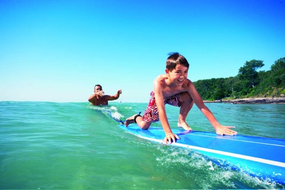 Surf lessons are one of the activities your children can enjoy on the Sunshine Coast.