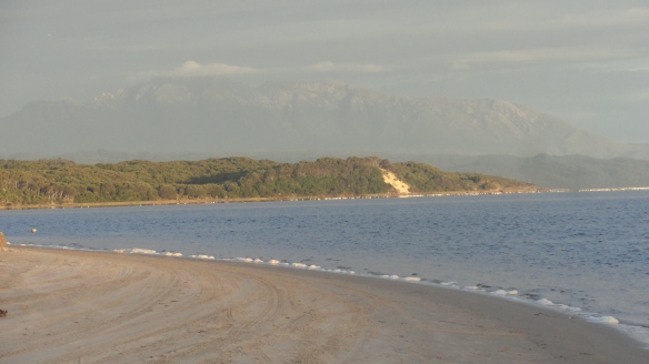 Looking back from Macquarie Heads towards Strahan, with Mt Lyell in the background.